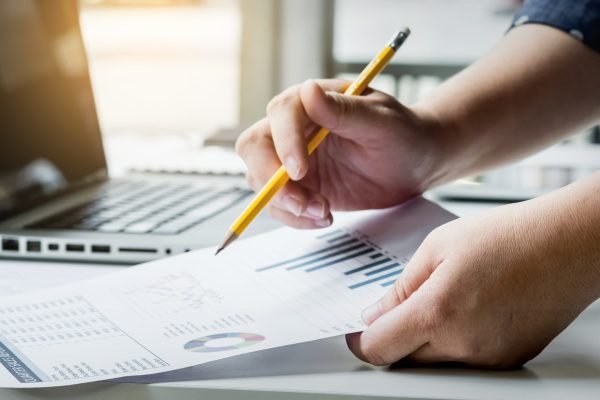 business managers working with new startup in modern loft.Analyze reports,plans
